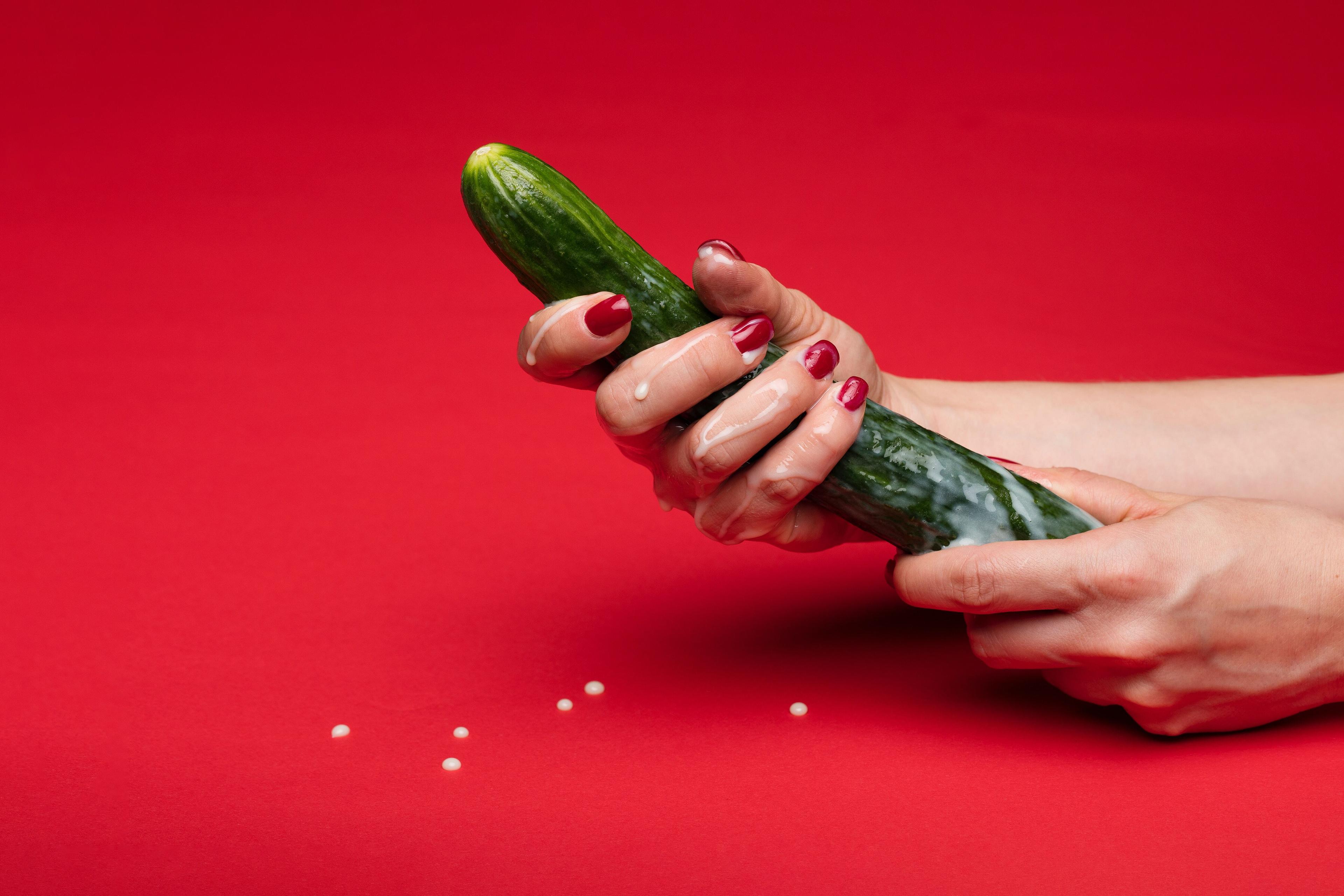 Woman holding cucumber